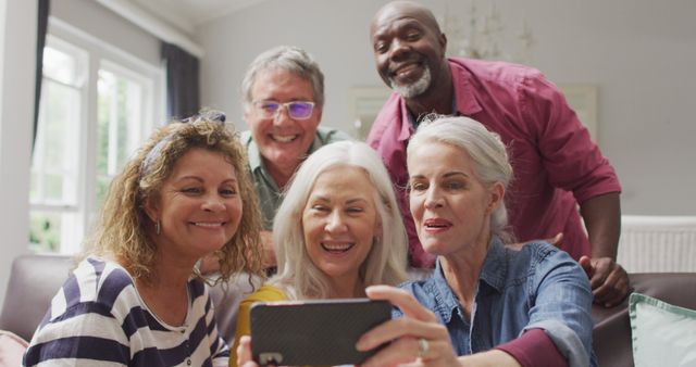 Group of Elderly Friends Taking Selfie Together in Living Room - Download Free Stock Images Pikwizard.com