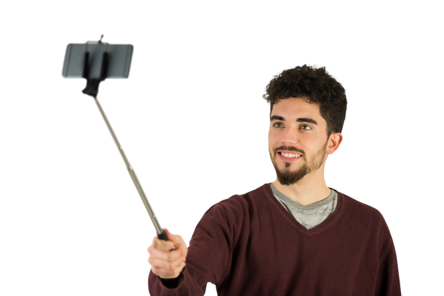 Transparent background of smiling man taking selfie with smartphone on selfie stick - Download Free Stock Videos Pikwizard.com