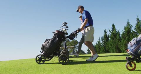 Senior Couple Enjoying a Sunny Day on the Golf Course - Download Free Stock Images Pikwizard.com