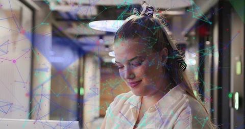 Businesswoman Analyzing Data Networks in Modern Office Environment