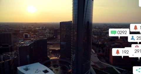 Golden sunset over modern urban skyline with digital chat overlays