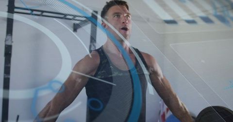 Muscular man catching breath after heavy lift in gym with futuristic hud overlay