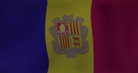 Andorra tricolor flag waving with coat of arms showing mitre, cows and latin motto on textured cloth