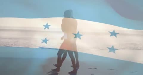 Couple Strolling Beach with Honduras Flag Overlay Radiating Tranquility