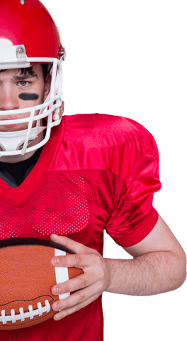 Half view of determined football player in red with ball on transparent background