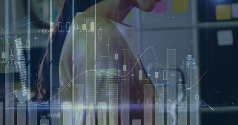 Businesswoman Analyzing Data Amidst Financial Graphs