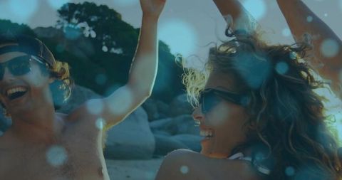 Carefree Friends Celebrating on Vibrant Beach Adventure