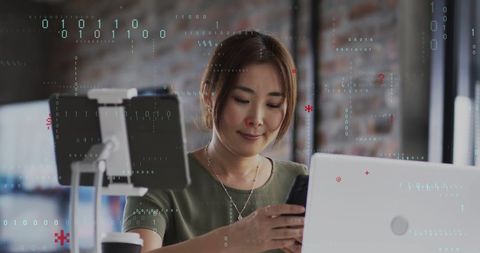 Businesswoman engaged with digital data and technology in modern office