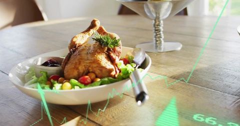 Serving sunlit roasted whole chicken on rustic wooden table with fresh greens and rosemary