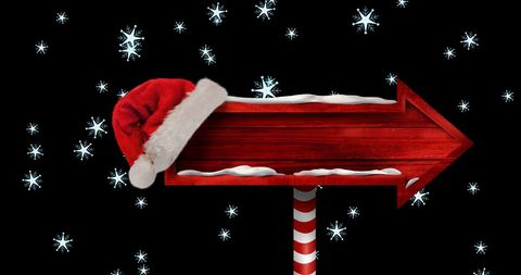 Christmas Directional Sign with Santa Hat and Falling Snowflakes