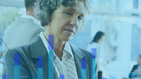 Senior Businesswoman Analyzing Data with Digital Tablet in Office