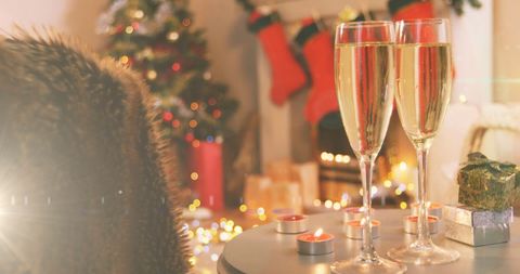 Festive Christmas with Champagne Flutes and Holiday Lights