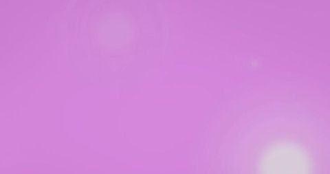 White bokeh lights on pink background radiating energy