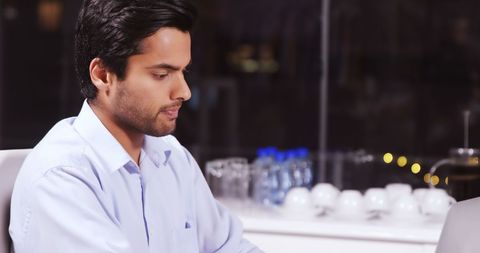 Late Night Office Work by Focused Business Professional