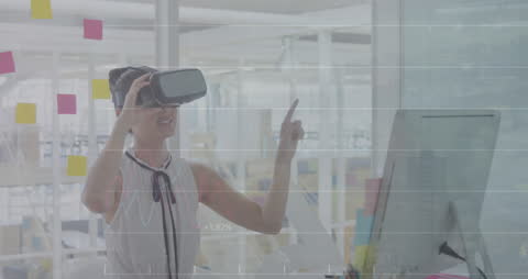 Young Professional Using VR Technology in Modern Office