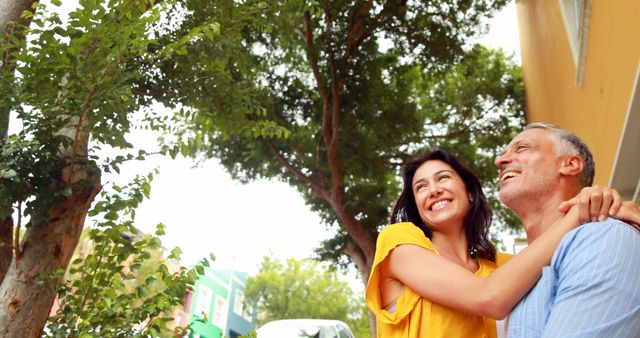 Cheerful Mature Couple Enjoying a Sunny Day Outdoors - Download Free Stock Images Pikwizard.com