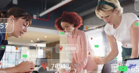 Three women collaborating at desk with augmented data overlays for team analytics