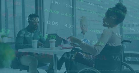 Diverse Coworkers Analyzing Digital Financial Data in Modern Office