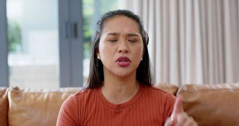 Confident woman expressing thoughts at home