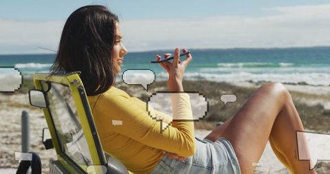 Woman Relaxing on Beach with Smartphone and Social Media Graphics