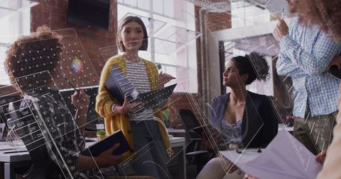 Diverse Team Analyzing Financial Data Innovations in Modern Office