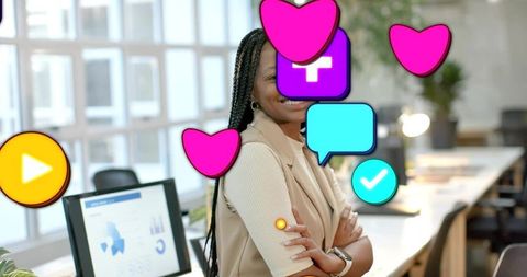 Standing businesswoman crossing arms in modern office with social icons overlay and charts