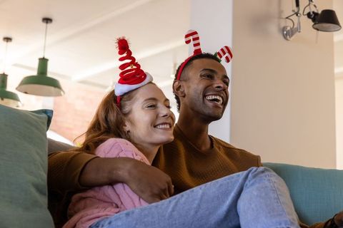 Cheerful Couple Celebrating Festive Holiday at Home