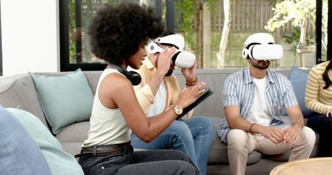 Diverse Friends Experiencing Virtual Reality in Living Room