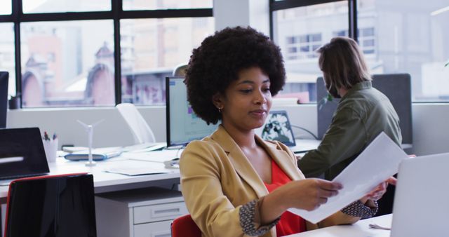 Professional Woman Analyzing Documents in Modern Office - Download Free Stock Images Pikwizard.com