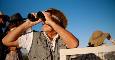 Safari Enthusiast Exploring Wildlife on Adventure Tour - Download Free Stock Images Pikwizard.com