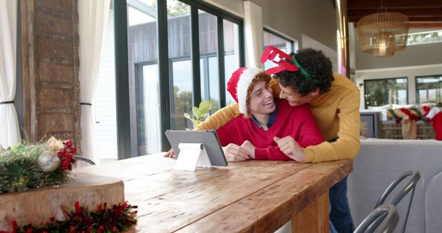 Festive Couple Embracing During Holiday Season at Home - Download Free Stock Images Pikwizard.com