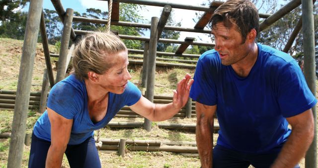 Two People Encouraging Each Other During Obstacle Course Training - Download Free Stock Images Pikwizard.com