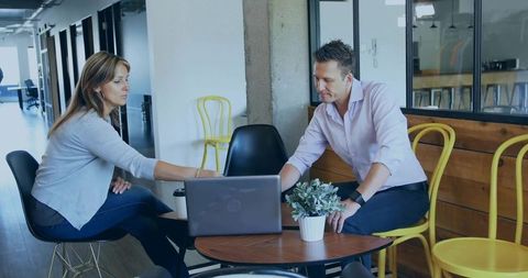 Colleagues collaboration in modern office lounge