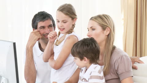 Happy Family Enjoying Computer Time at Home