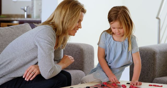 Mother and Daughter Playing Checkers Together at Home - Download Free Stock Images Pikwizard.com