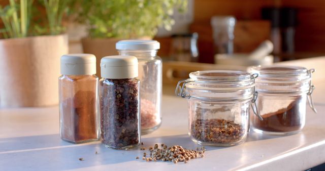 Various Spices in Glass Jars in a Bright Kitchen - Download Free Stock Images Pikwizard.com