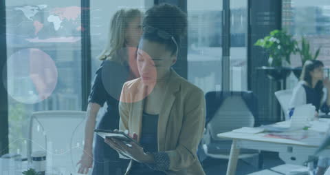 Smart Businesswoman Analyzing Digital Data on Tablet