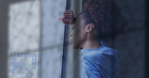 Pensive African American Doctor Staring through Rainy Window - Download Free Stock Images Pikwizard.com