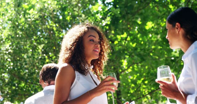 Women Socializing Outdoors with Drinks During a Sunny Day - Download Free Stock Images Pikwizard.com