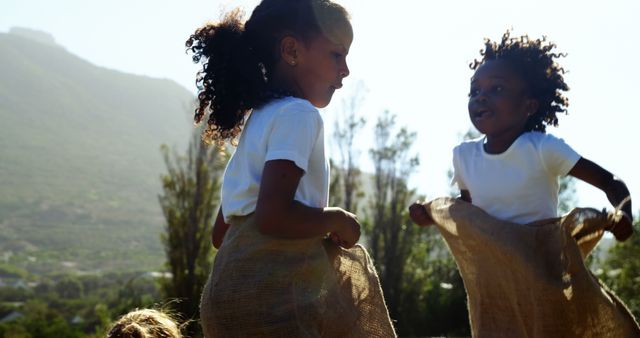 Children Enjoying Outdoor Sack Race on a Sunny Day - Download Free Stock Images Pikwizard.com