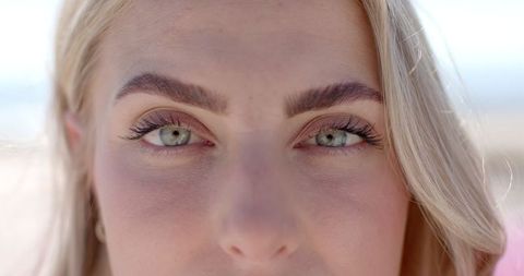Close-Up of Woman with Intense Gaze on Sunlit Road Trip - Download Free Stock Images Pikwizard.com