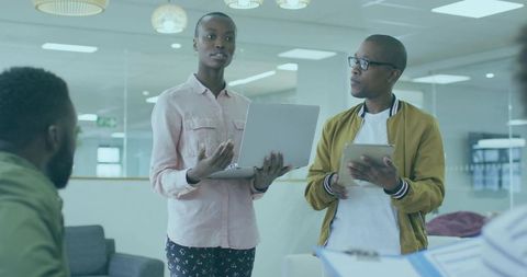 Professionals Engaging in Collaborative Workplace Discussion