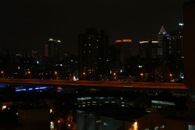Urban Nightscape with City Lights and Highway - Download Free Stock Photos Pikwizard.com