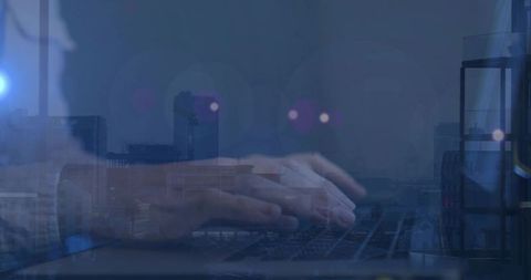 Mid-adult woman typing on laptop with urban dusk double-exposure and lens flare