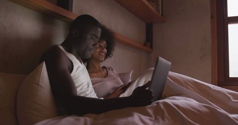 Couple Enjoys Tablet in Cozy Bedroom Atmosphere - Download Free Stock Images Pikwizard.com