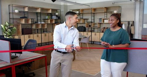 Diverse Team Celebrating Business Launch in Modern Office