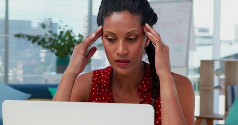 Stressed businesswoman facing workplace challenges