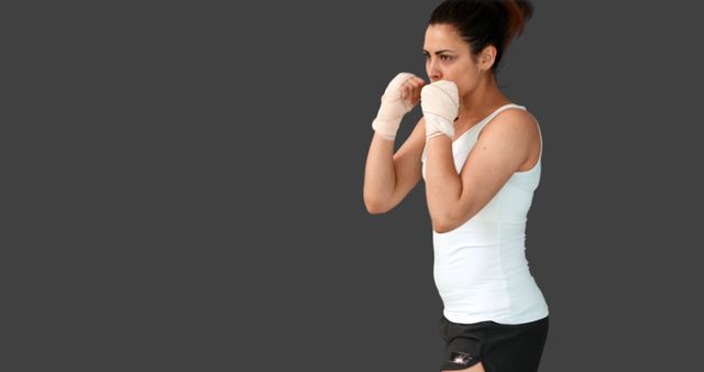 Female Boxer in Defensive Stance with Hand Wraps - Download Free Stock Images Pikwizard.com