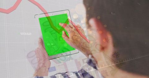Man Using Digital Tablet Analyzing Financial Data with Decline Chart