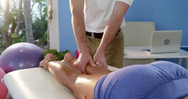 Physiotherapist Massaging Calf of Person on Therapy Table - Download Free Stock Images Pikwizard.com